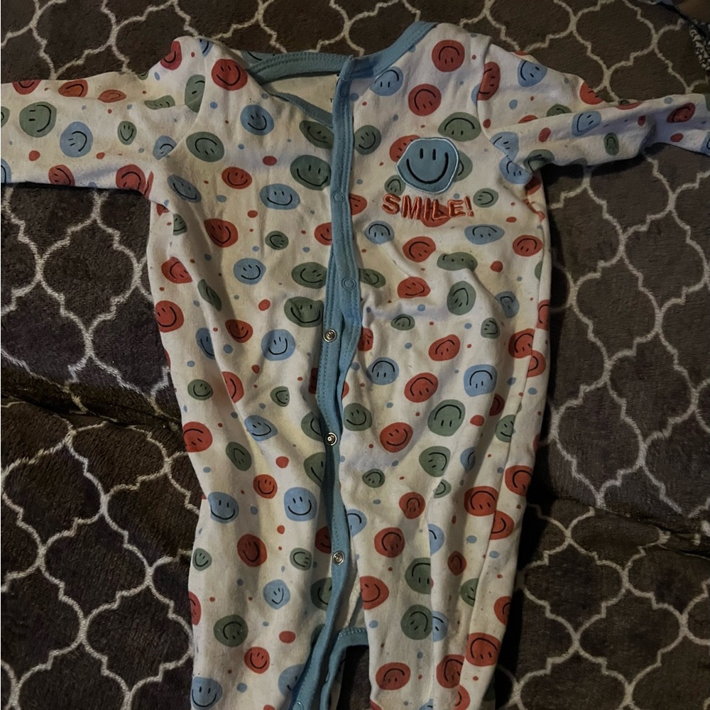 Smiley face onesie
